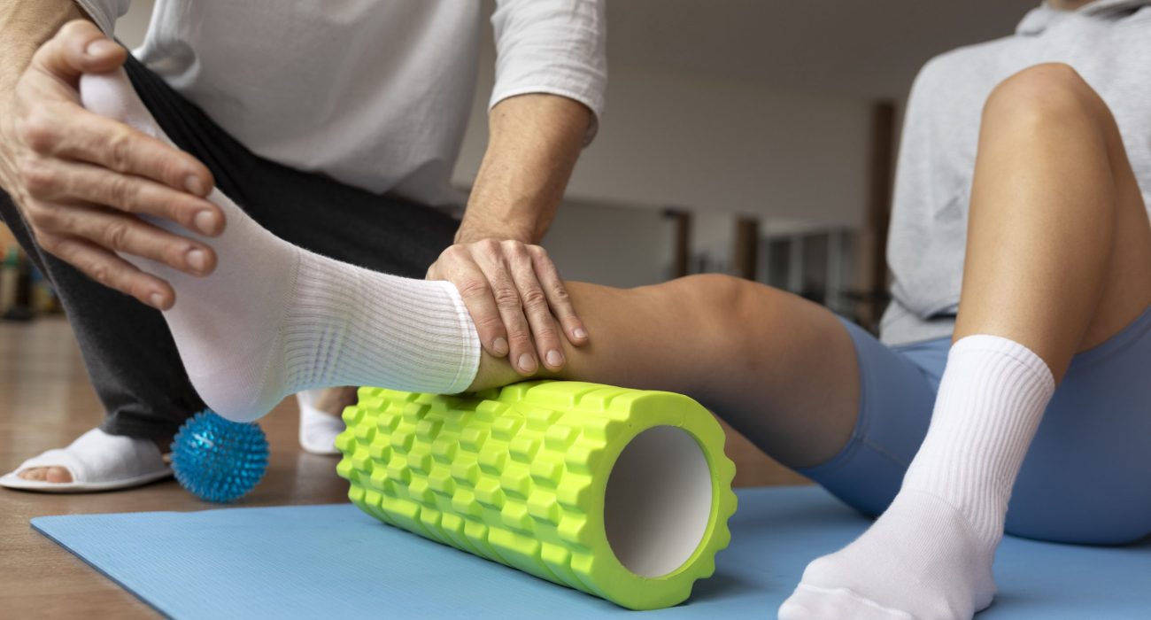 patient-doing-physical-rehabilitation-helped-by-therapists